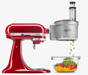Red Stand Mixer using fresh prep attachment to intricately dice red, yellow and green peppers.