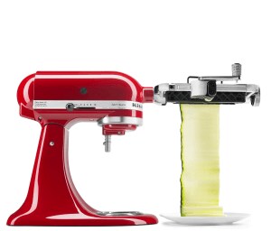 
                              Red stand mixer using fresh prep attachment to cut zucchini into sheets.
                          
