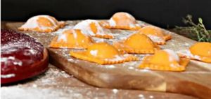 Ravioli filled with a red pepper sauce that's designed to please.