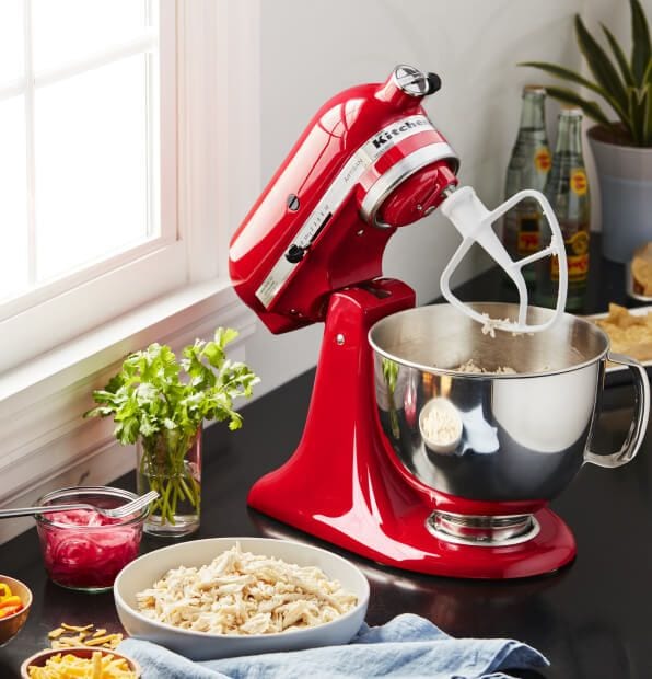Passion Red KitchenAid® stand mixer with baking ingredients