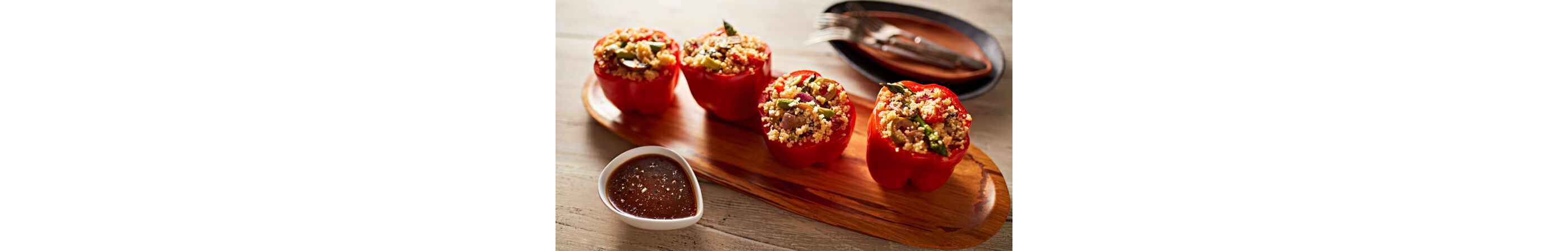 Red peppers stuffed with veggies and couscous