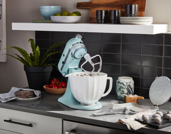 Mineral Water Blue KitchenAid® stand mixer on a counter with baking ingredients