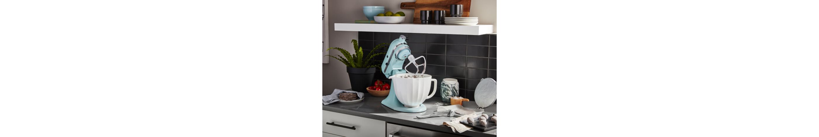 Mineral Water Blue KitchenAid® stand mixer on a counter with baking ingredients