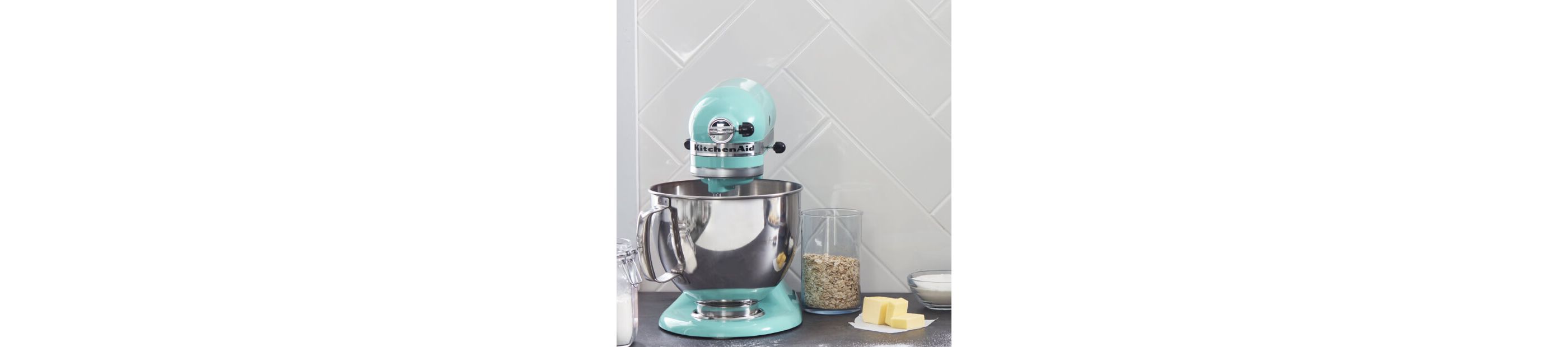 Aqua Sky KitchenAid® stand mixer on a counter with oats and butter
