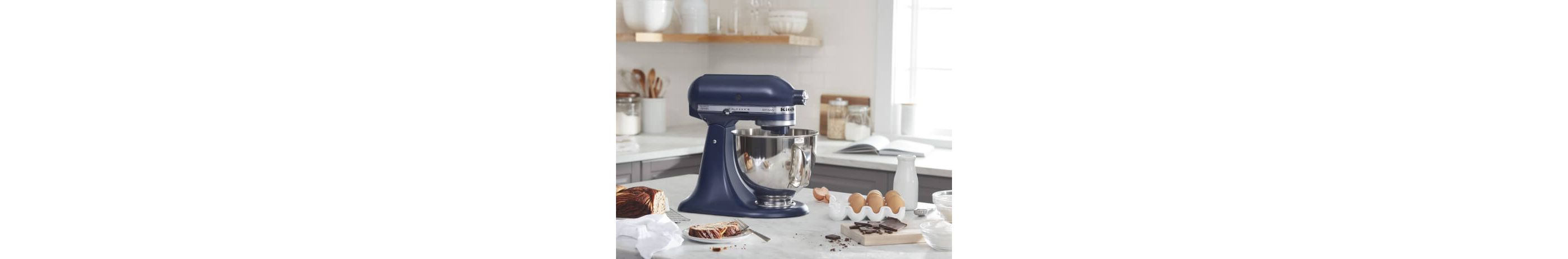 Ink Blue KitchenAid® stand mixer on a counter with baking ingredients