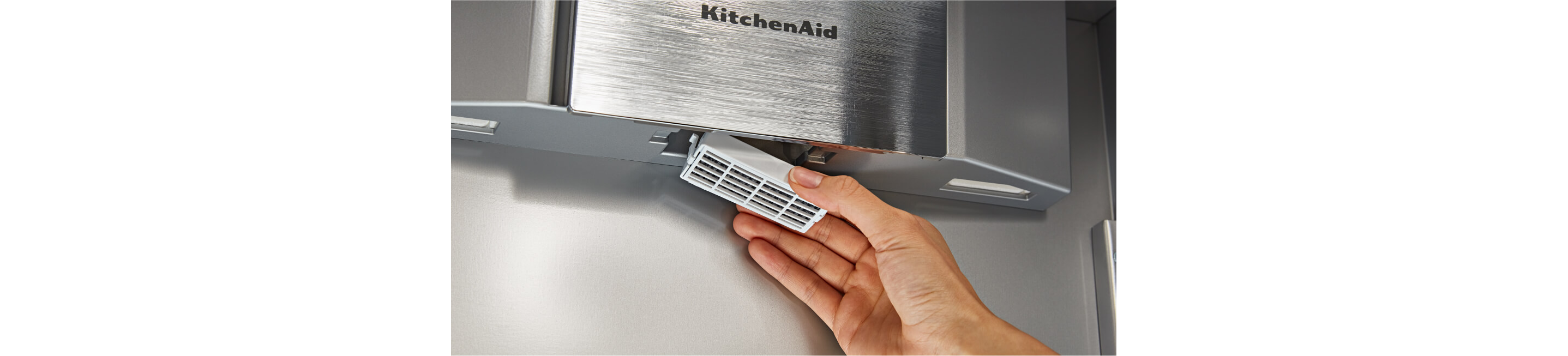A person removing the FreshFlow™ Air Filter