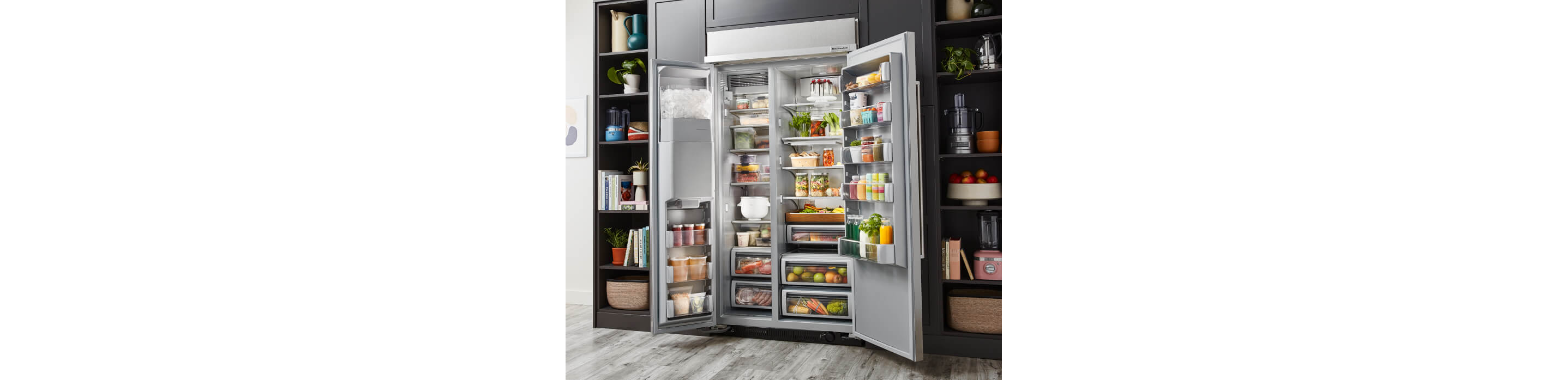 KitchenAid® Built-In Side-by-Side Refrigerator filled with ingredients showcasing the ExtendFresh™ Temperature Management System