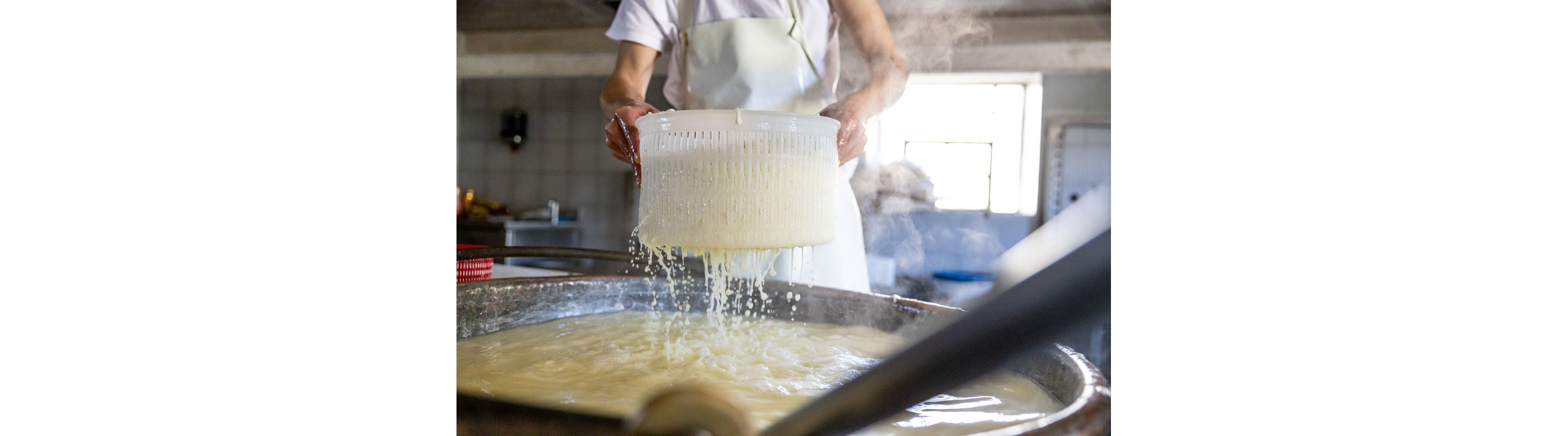 Straining curds.