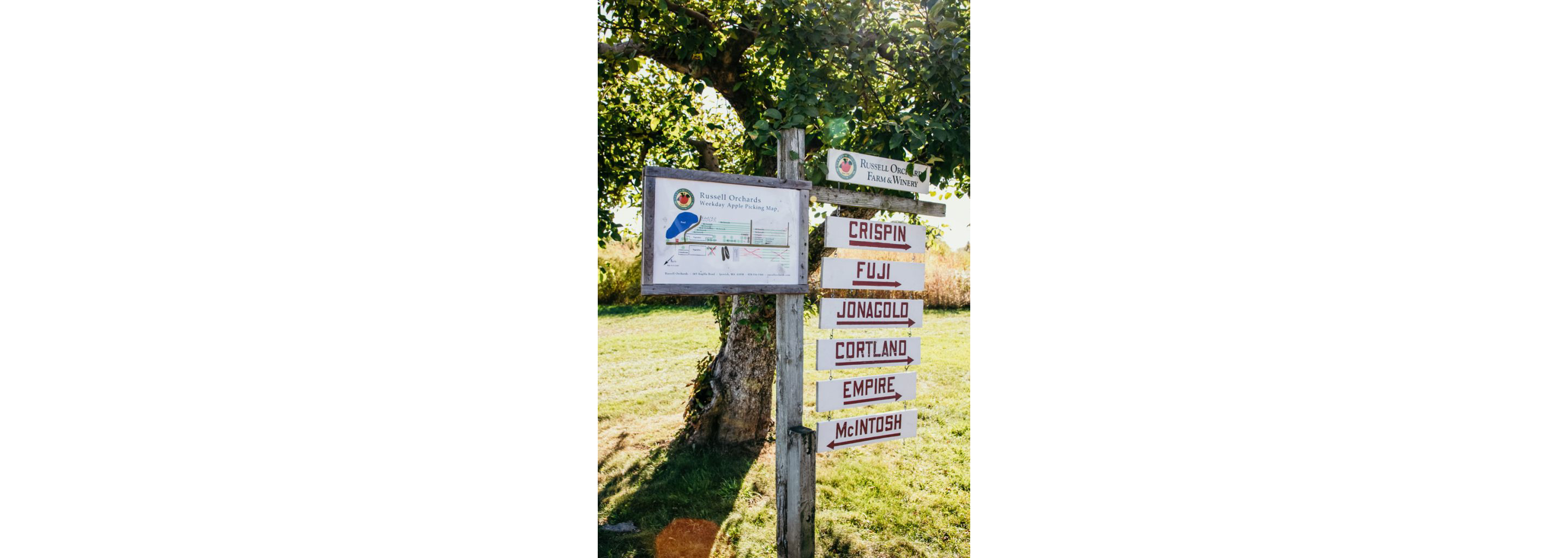 A sign with the variety of apples at Russell Orchard.