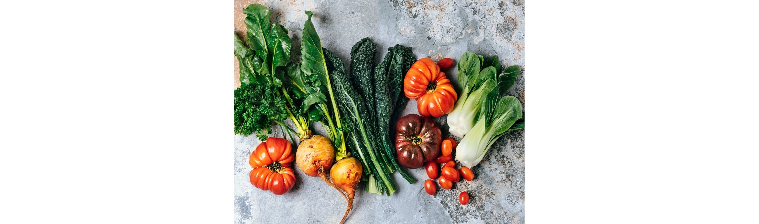 A table featuring a variety of heirloom vegetables.