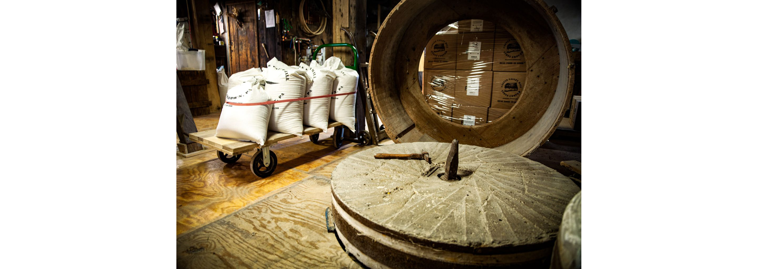 The inside of the grain farm featuring the old stone grain mill.