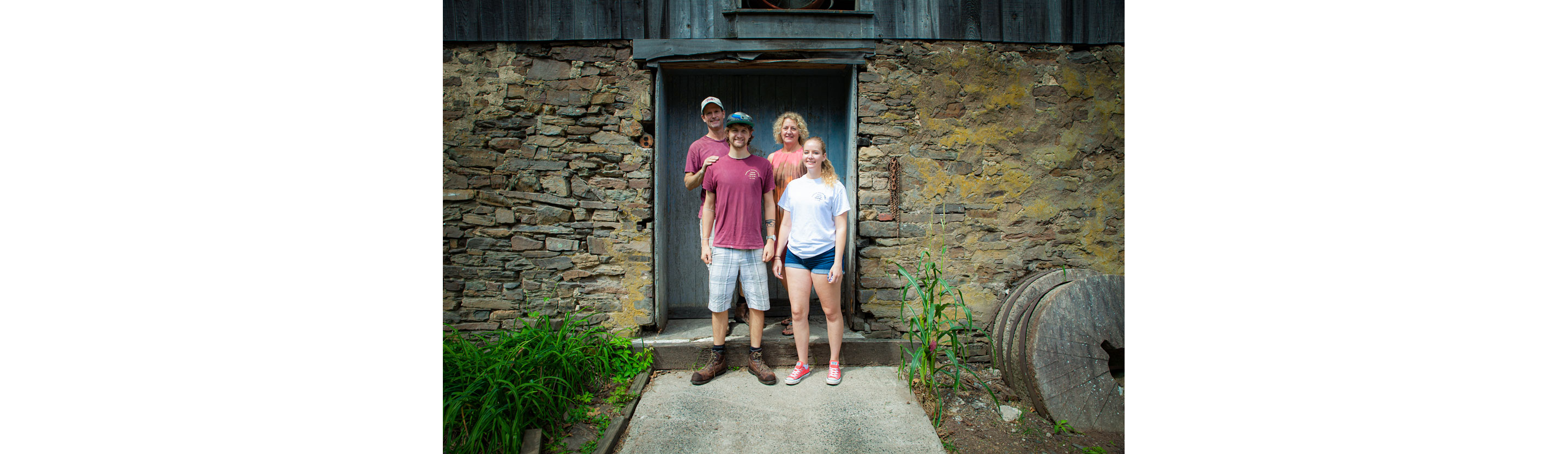 The Fischer family smiling together for a family photo.