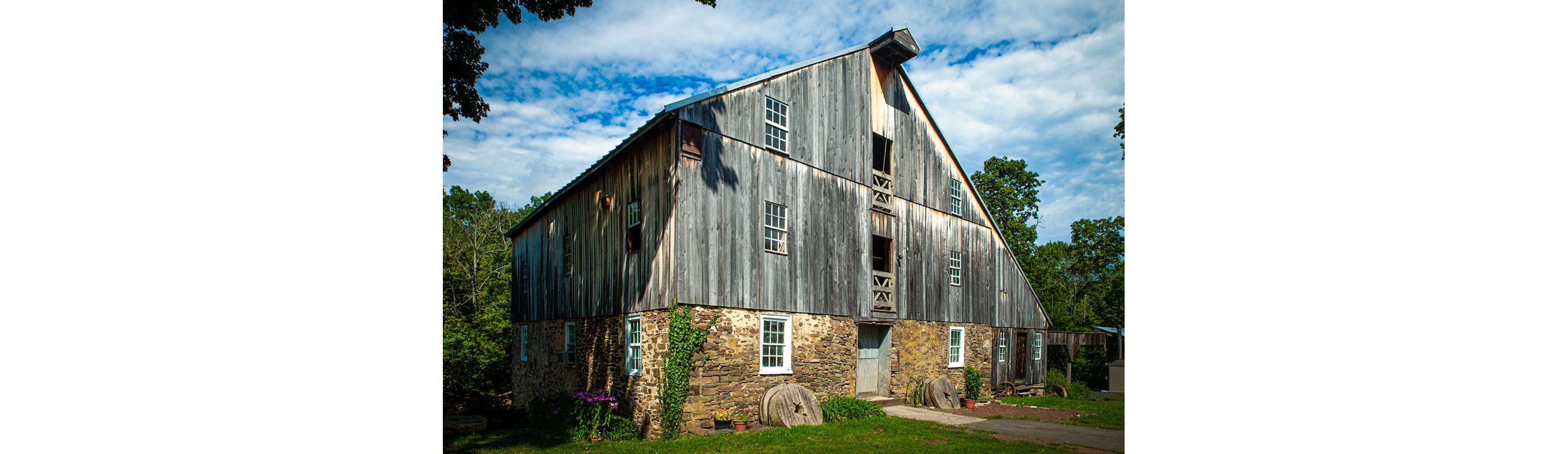 A family grain farm filled with early afternoon sun.
