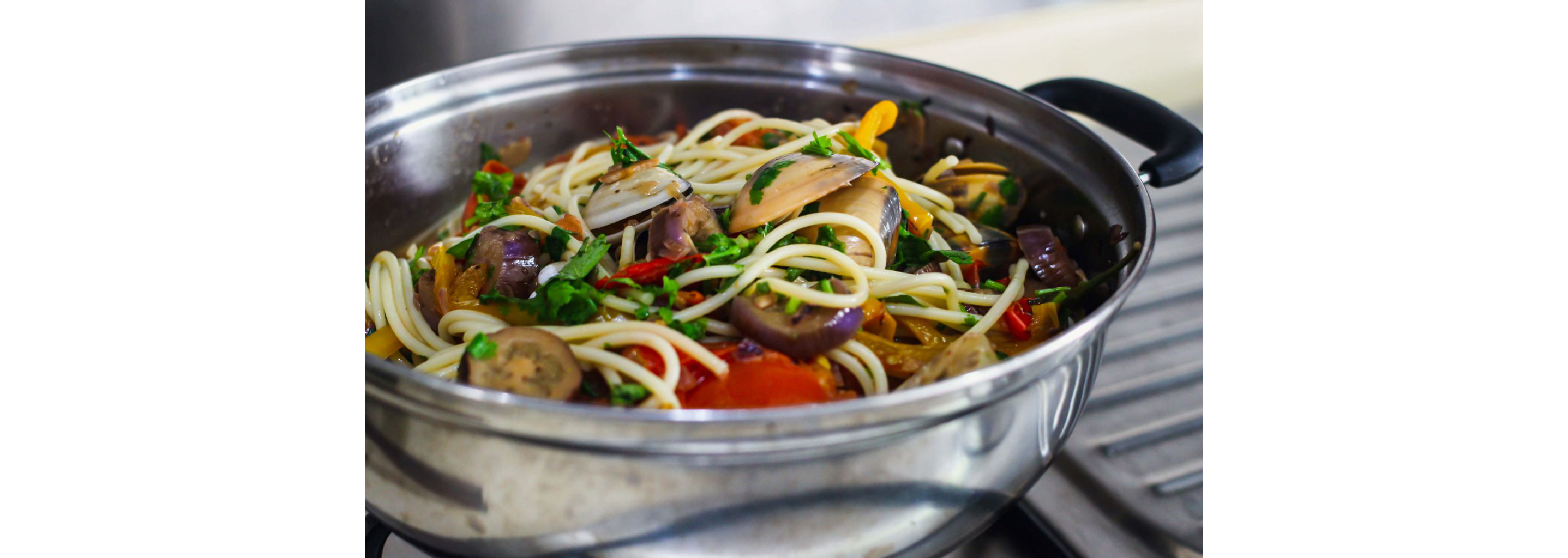 Freshly made Spicy Clam Pasta in a large pot.