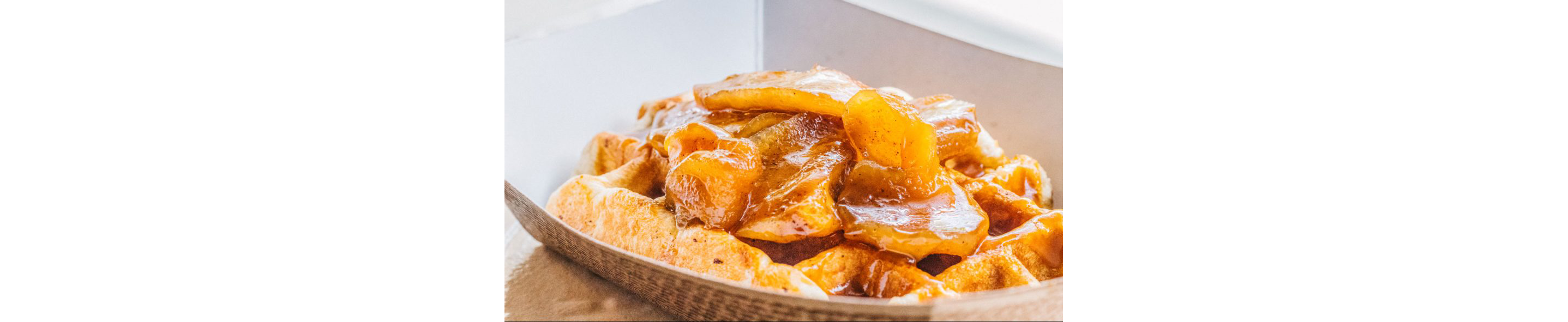A waffle topped with caramelized fruit filling from Nina's Ice Cream.