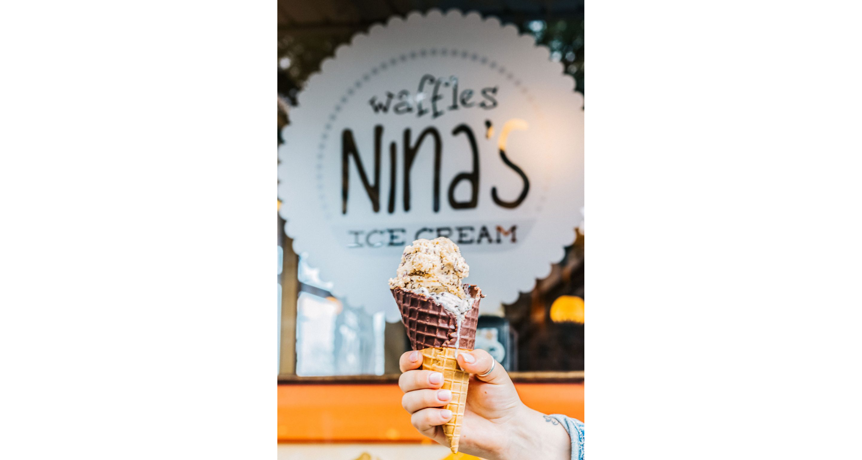 A chocolate cone topped with ice cream from Nina's Ice Cream.