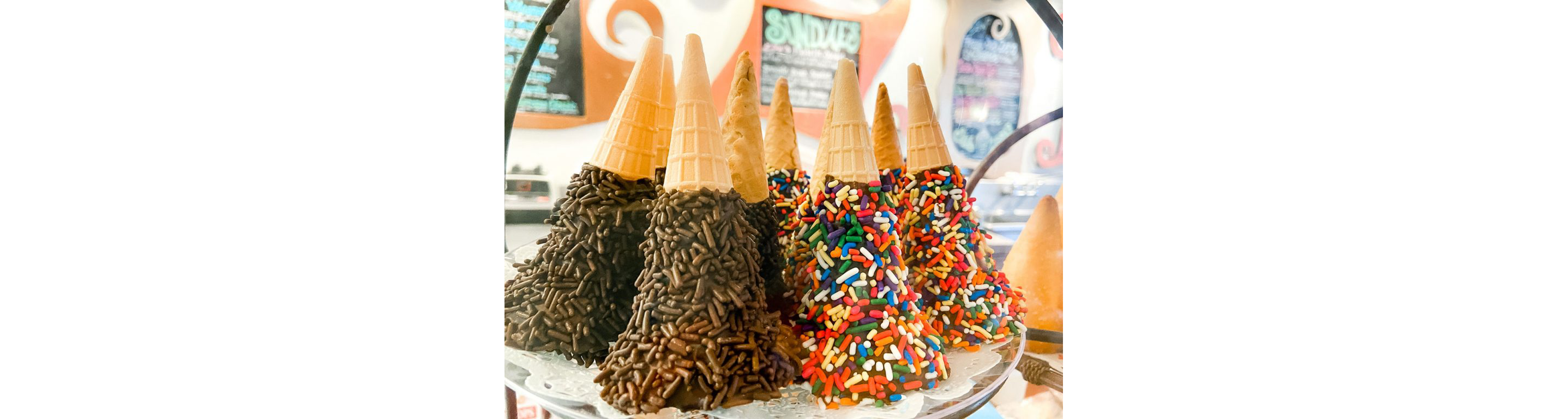 Ice cream cones covered in chocolate and sprinkles from The Zebra Striped Whale.