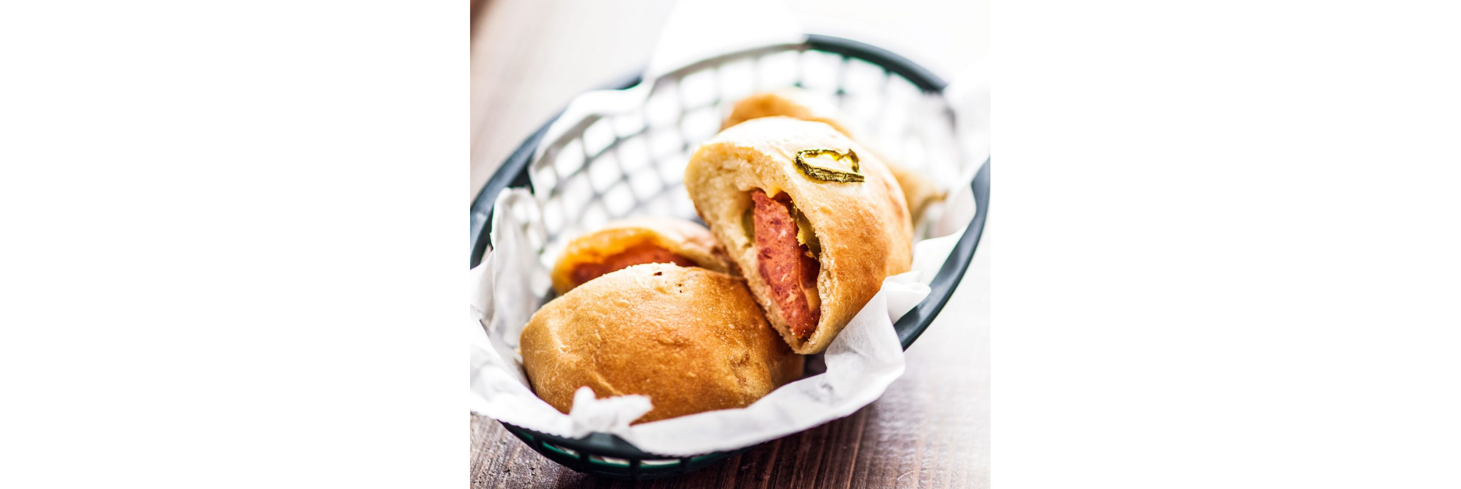 A basket of meat kolaches.