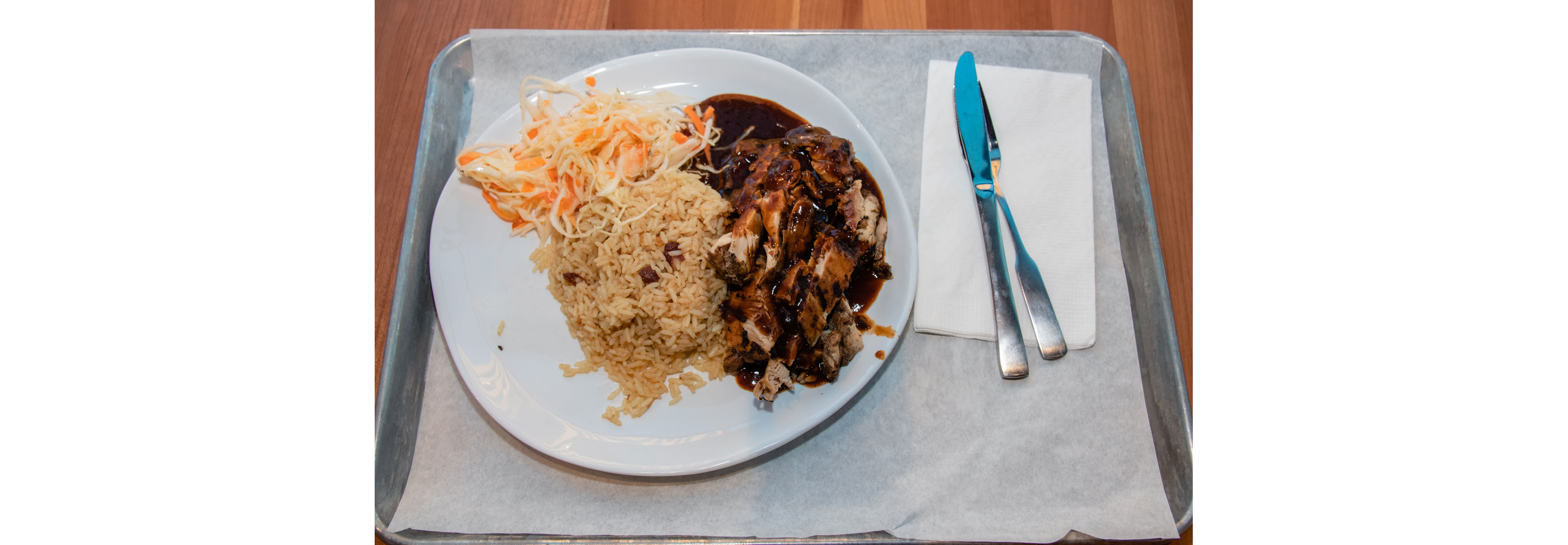 A large plate of Jamaican food.