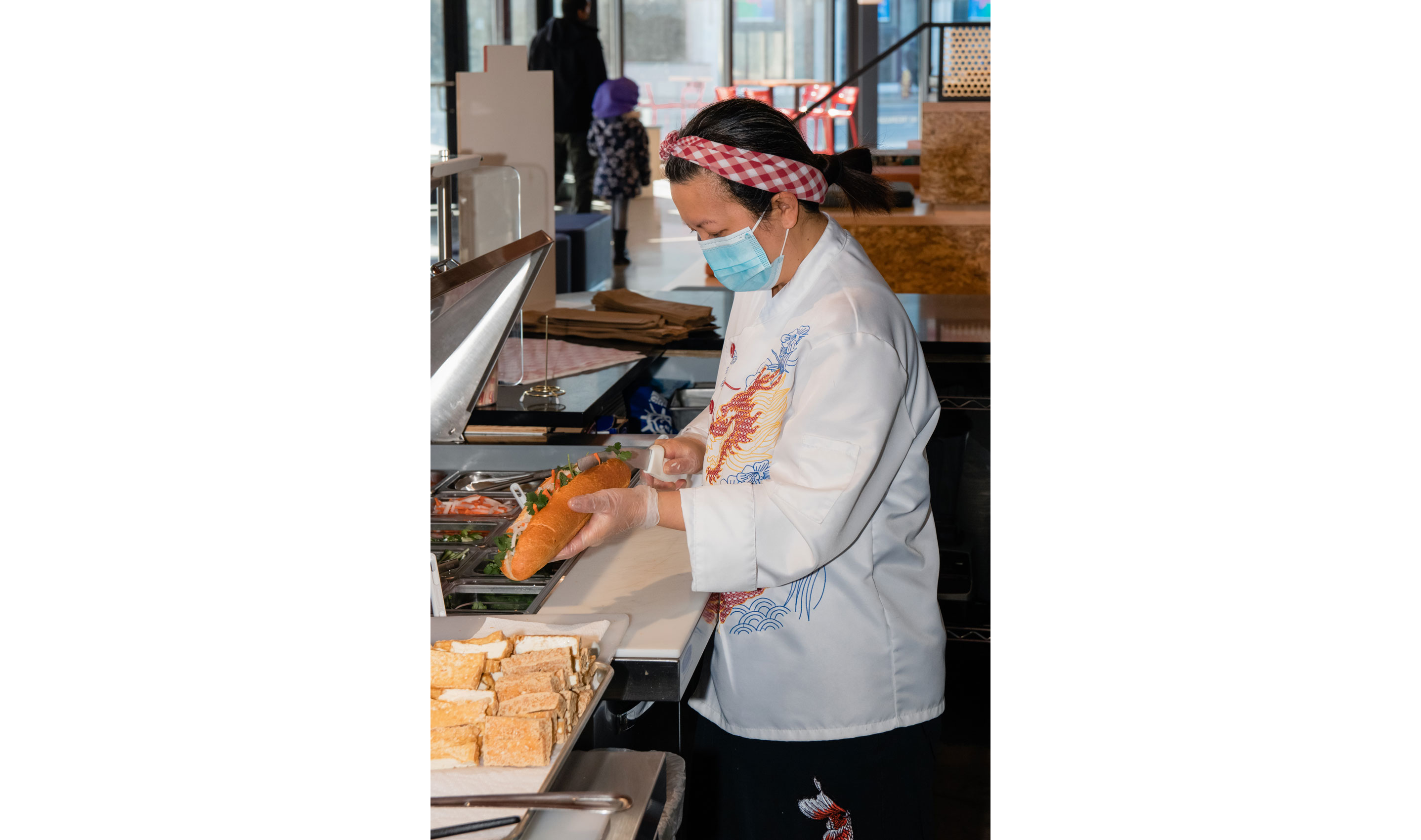 Ngoc making a large sandwich.