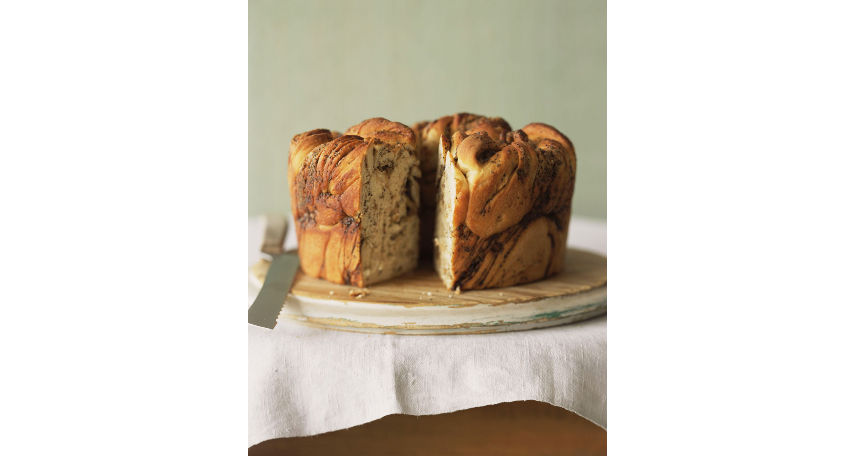 Poppy seed babka bread, minus a single perfectly cut slice.