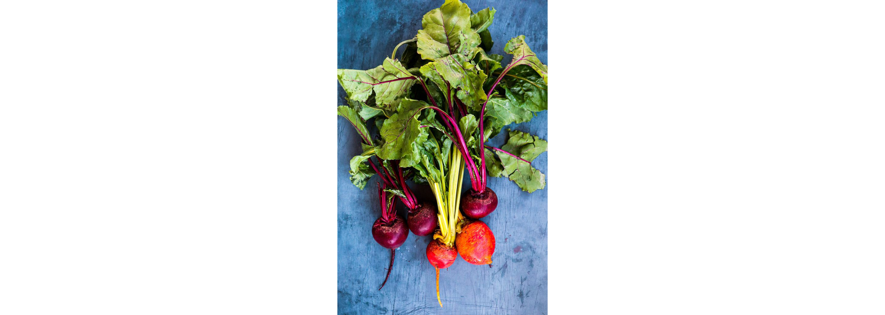 Clean beetroots resting on a table.