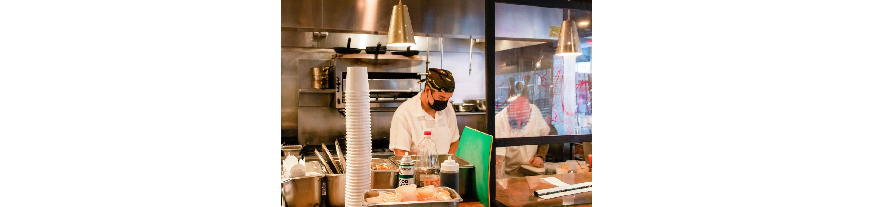 Chefs dilligently working in the restaurant kitchen of Myers + Chang.