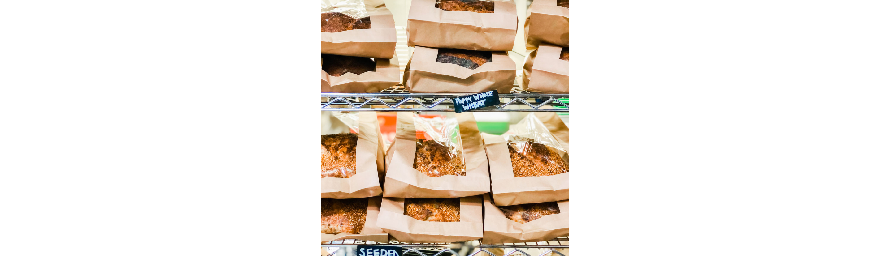Paper-bagged breads on display.
