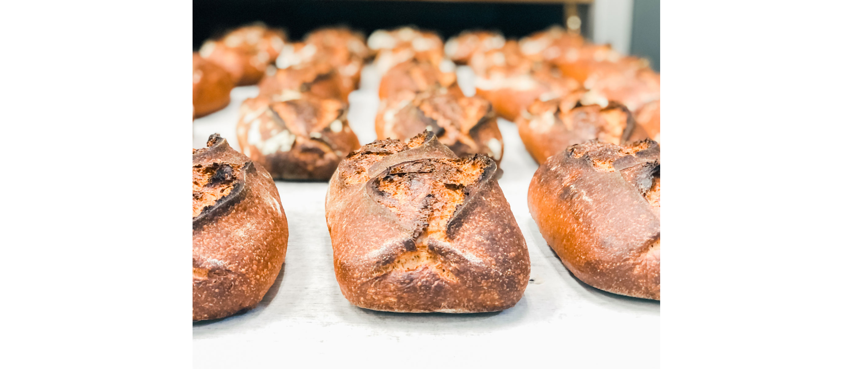 Freshly baked bread pulled from the oven.