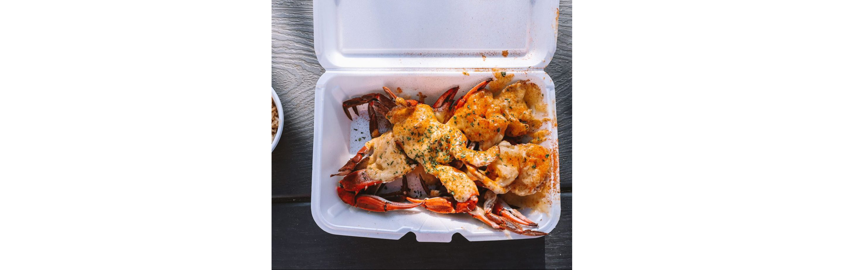 A metal tray topped with barbecue from Rodney Scott's BBQ.