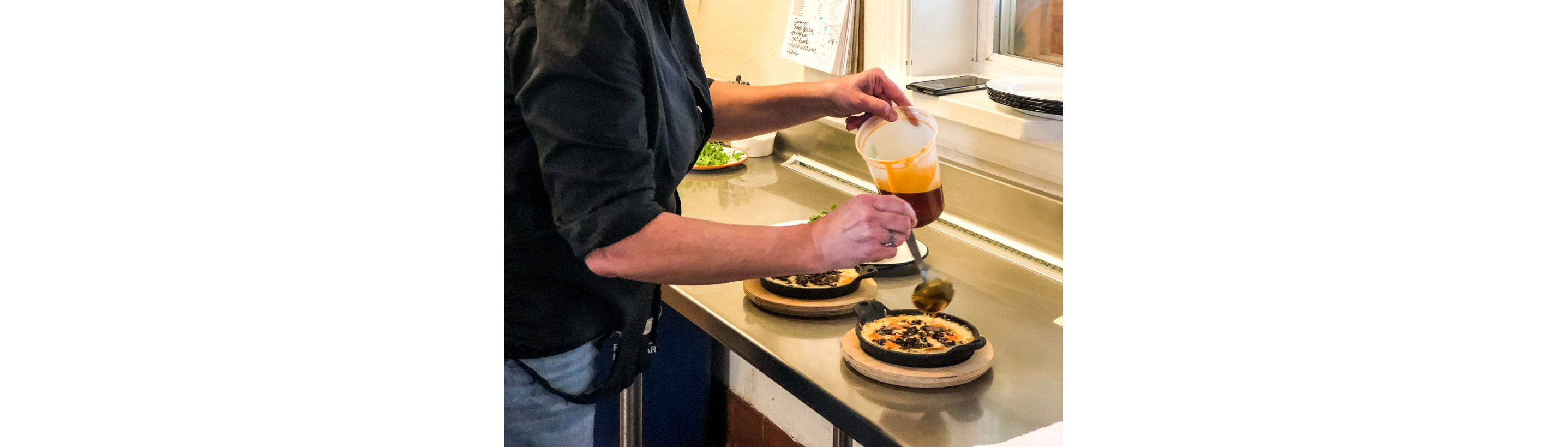 Chef McMurry plating food.