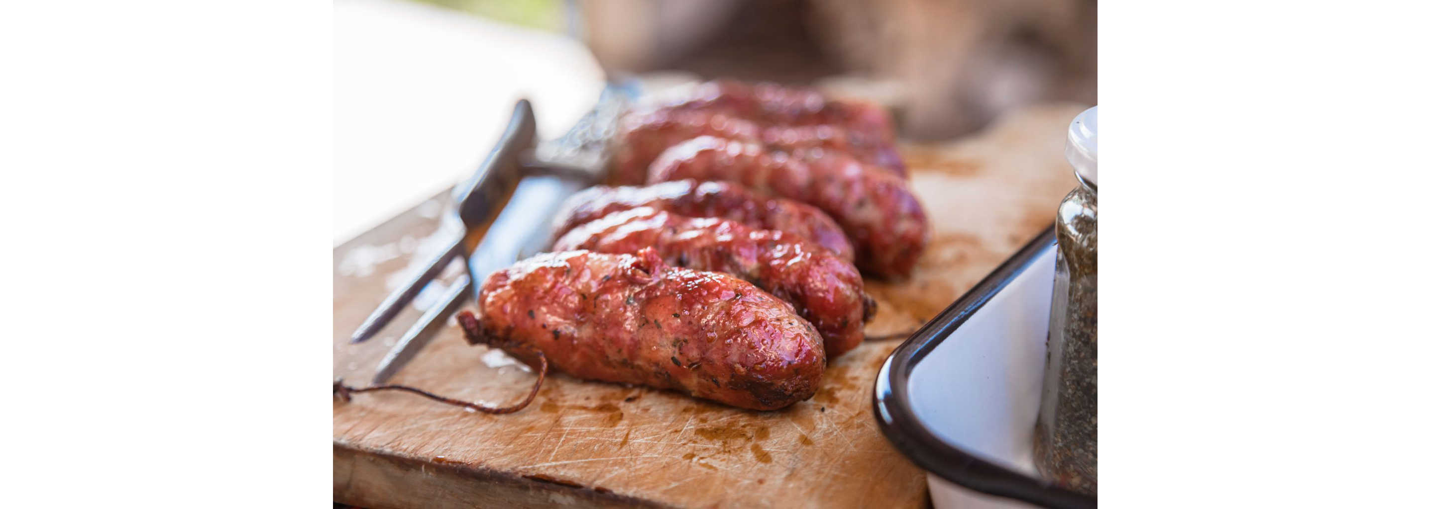 Grilled meat on a cutting board.