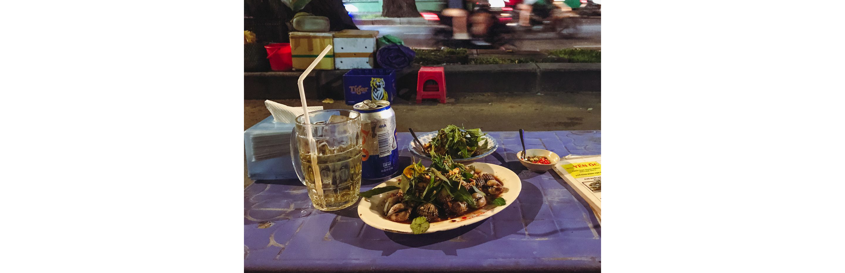 Two delicious dishes served with a glass of beer.