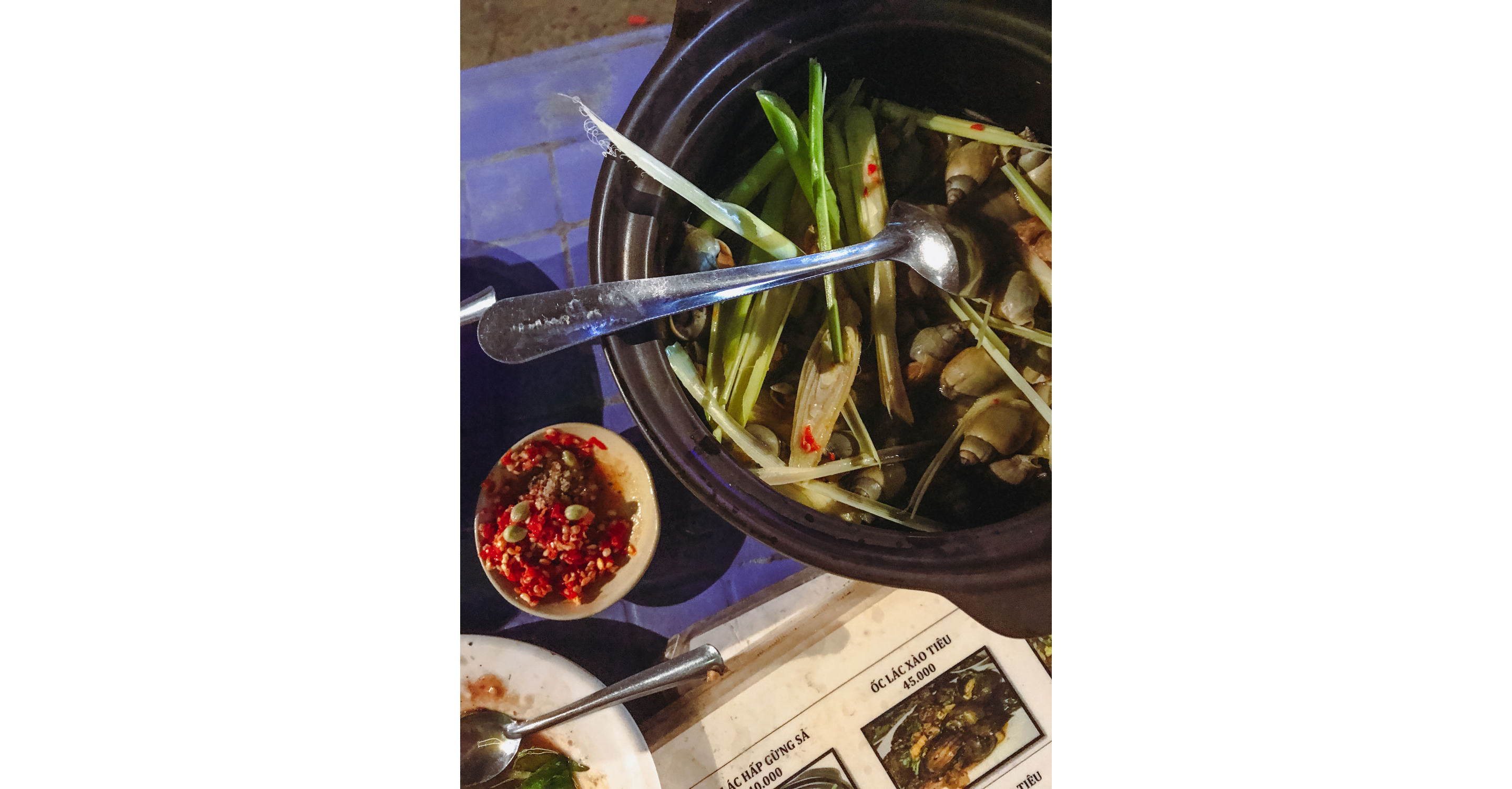 A bowl of sea snails steamed with ginger and lemongrass.