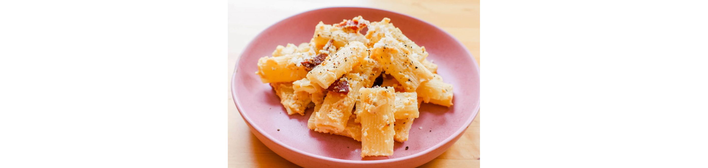 A plate of hearty pasta with parmesan.