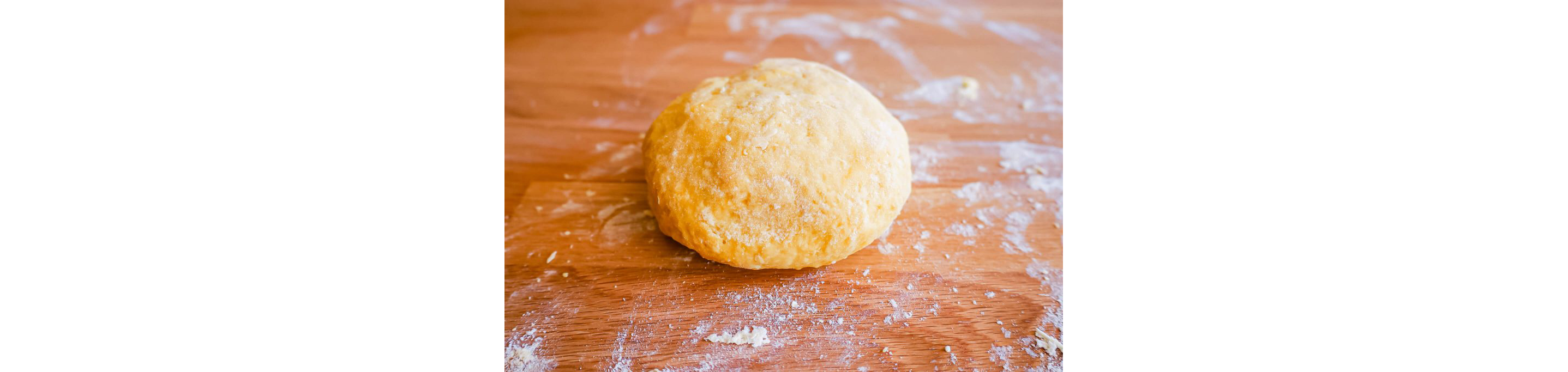 A ball of dough resting on a table.