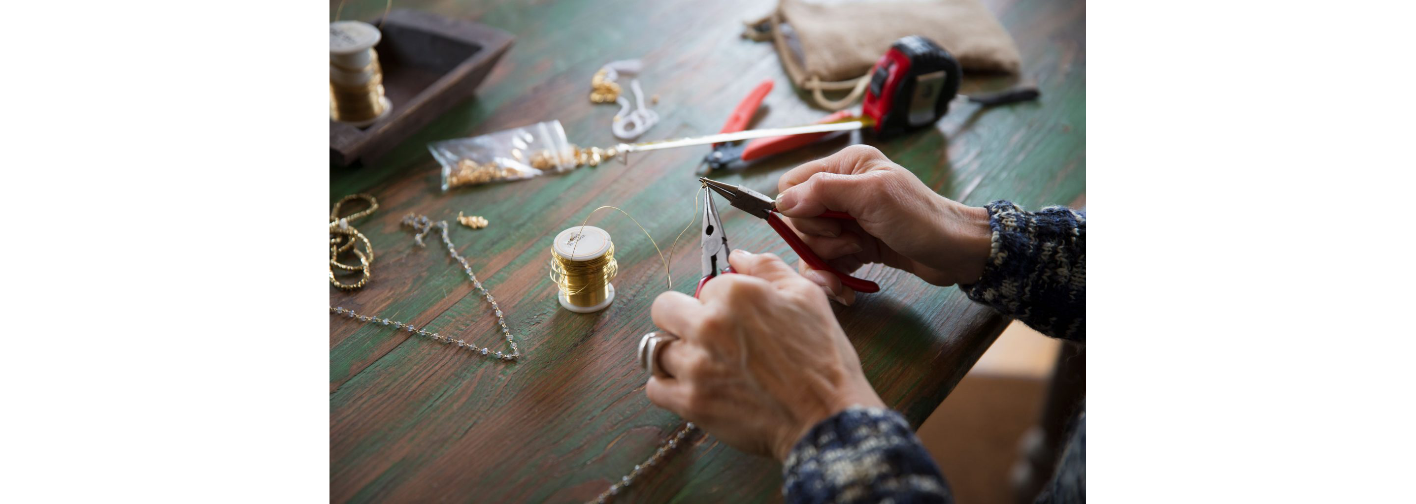 Skillful hands masterfully cutting delicate jewelry wire.