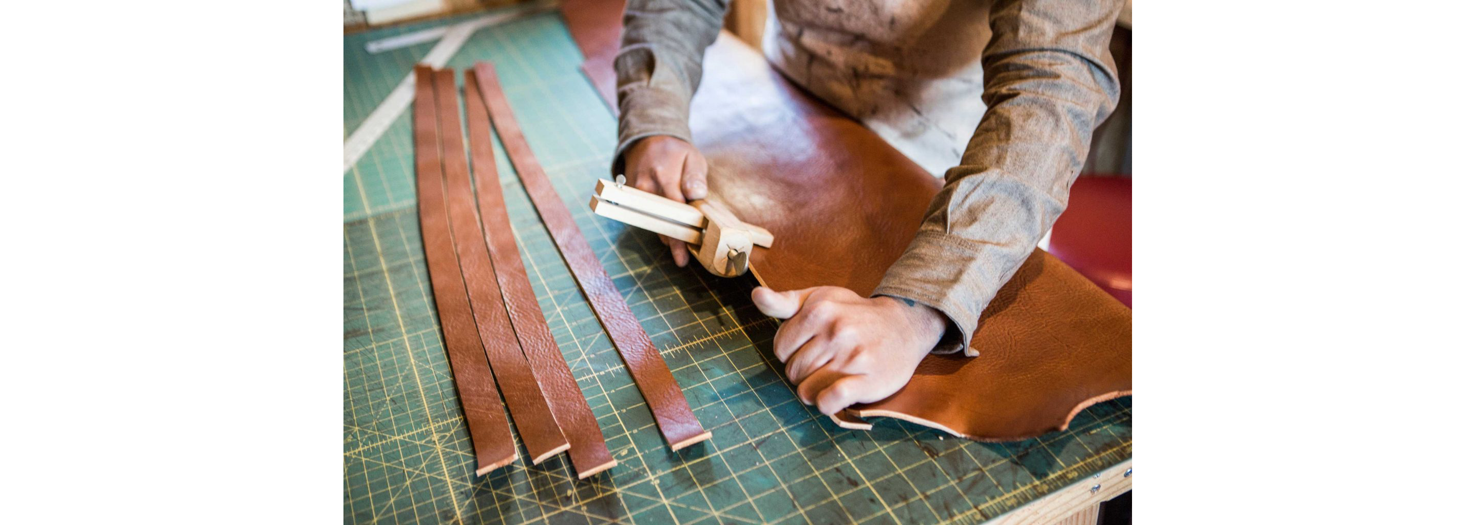 Strong hands working with tough, beautiful leather.