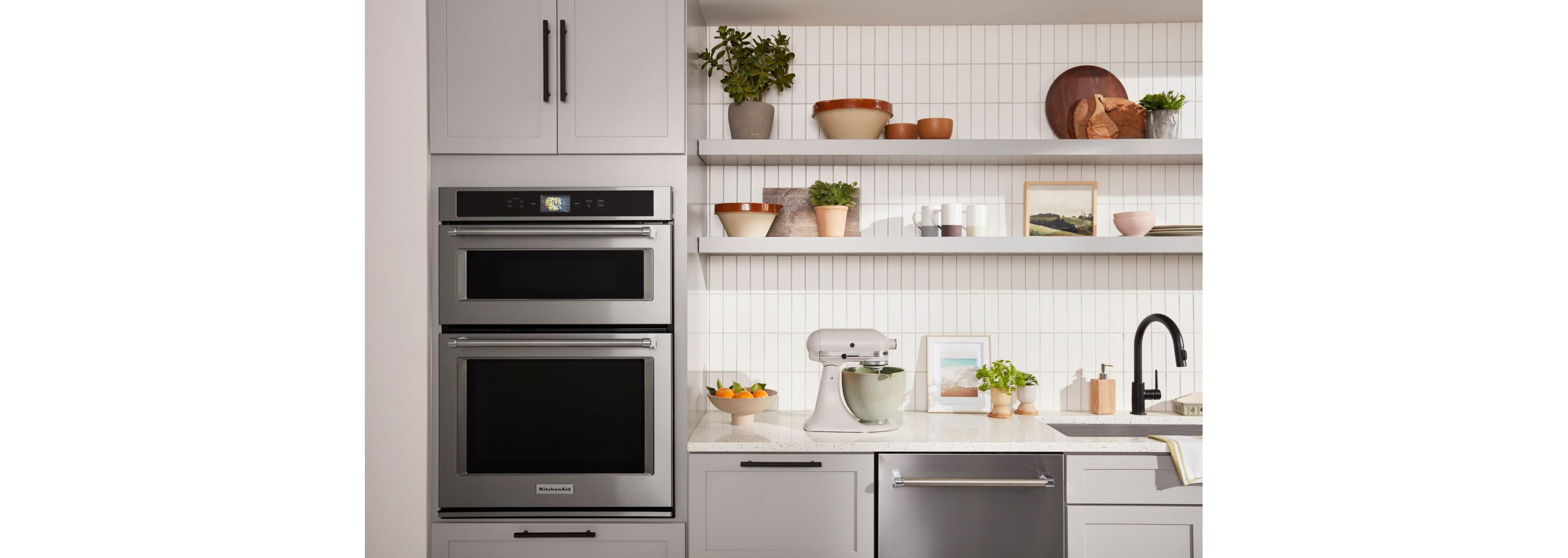 A clean, white kitchen with KitchenAid® appliances.