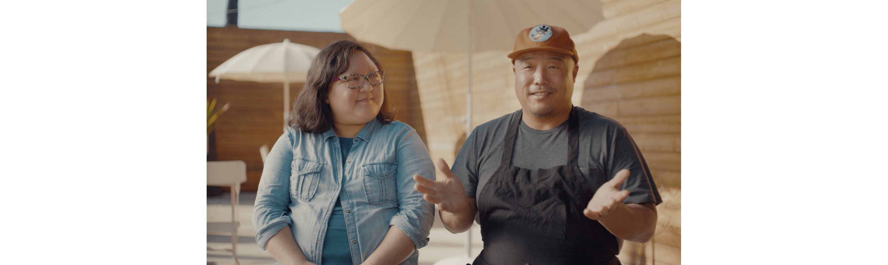 A candid photo of Richard Chang and Janelle Hu.