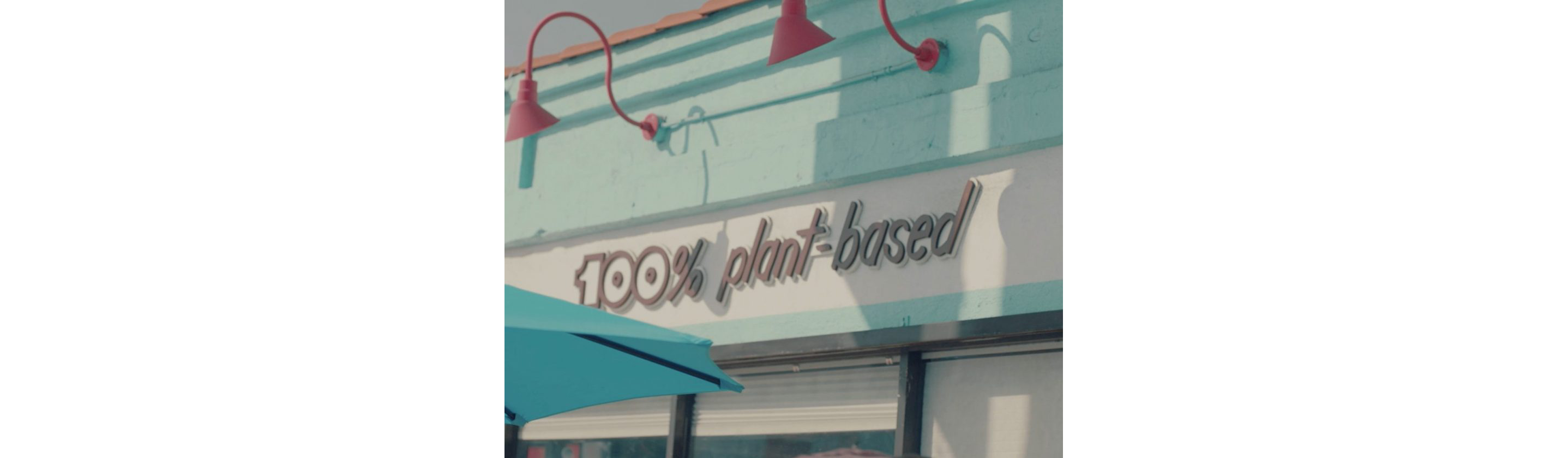 A sign that says 100% plant-based.