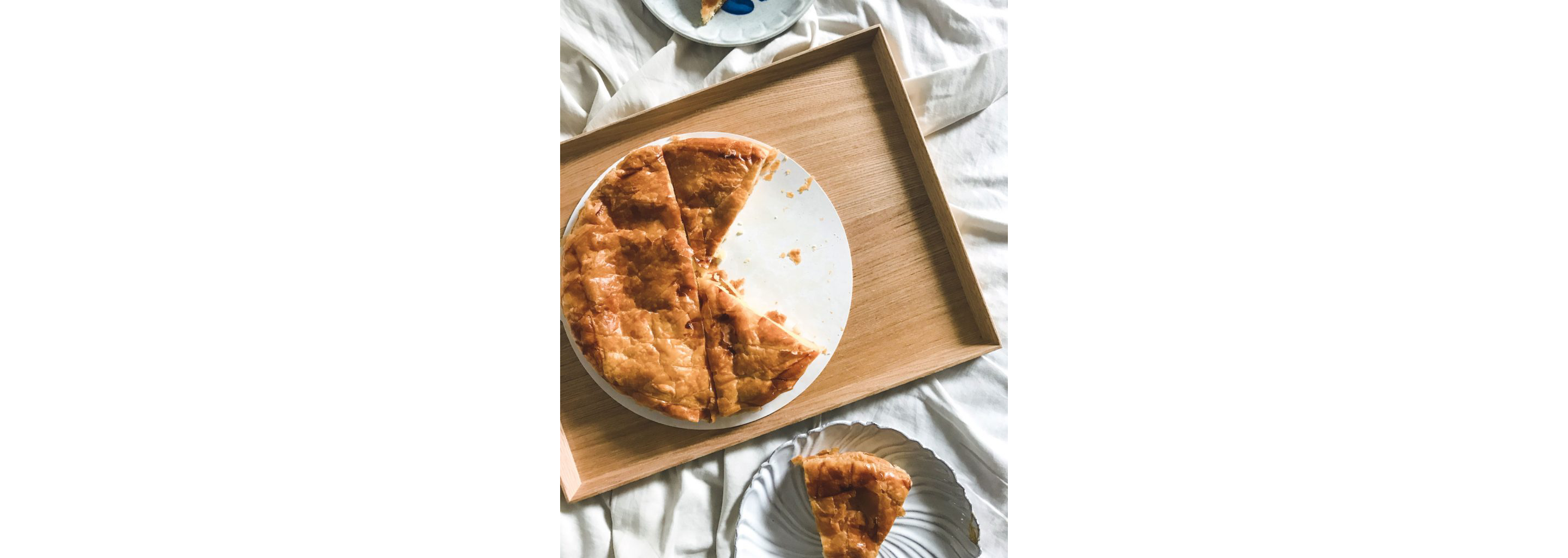 A galette des rois missing a few slices.