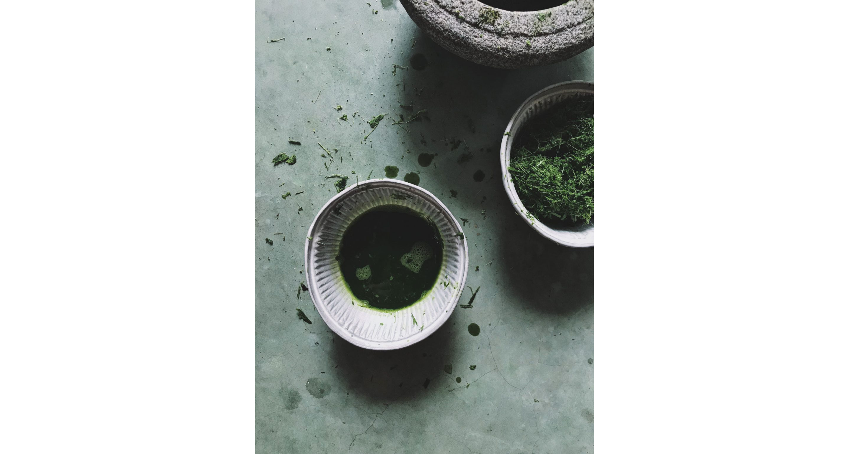 A ceramic dish holding a soft green liquid.