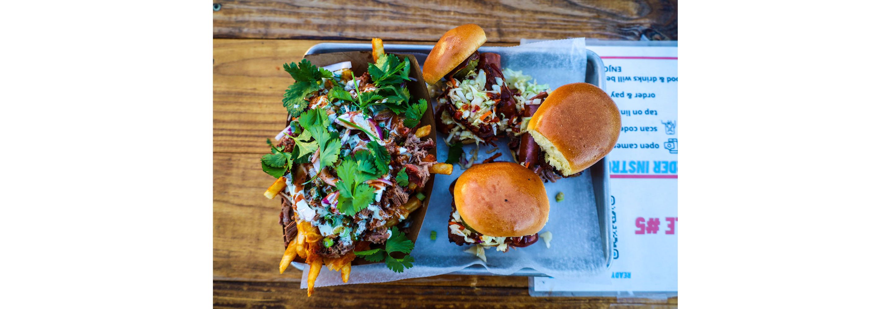 Loaded french fries and sandwiches.