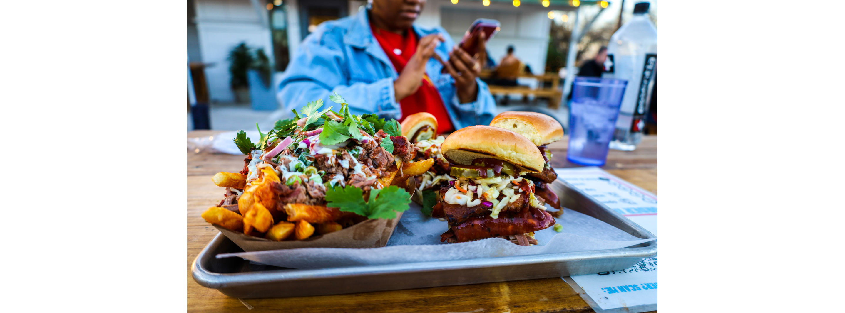 Loaded french fries and sandwiches.