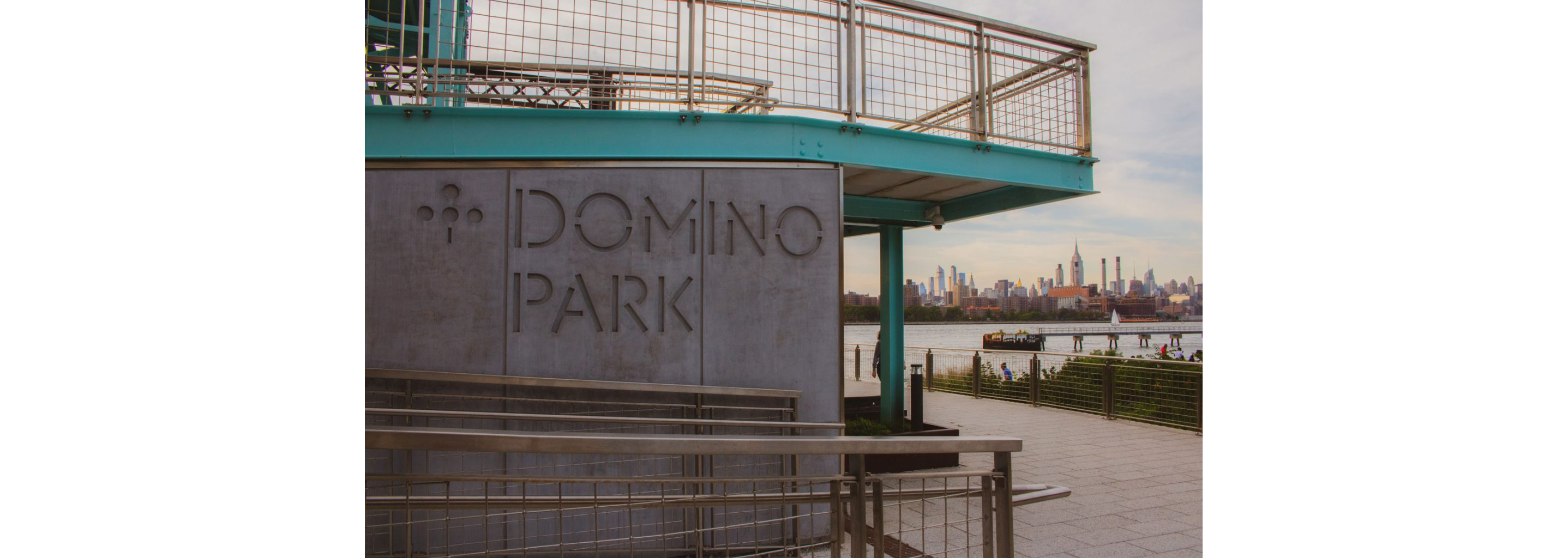 The large, concrete sign of Domino Park.