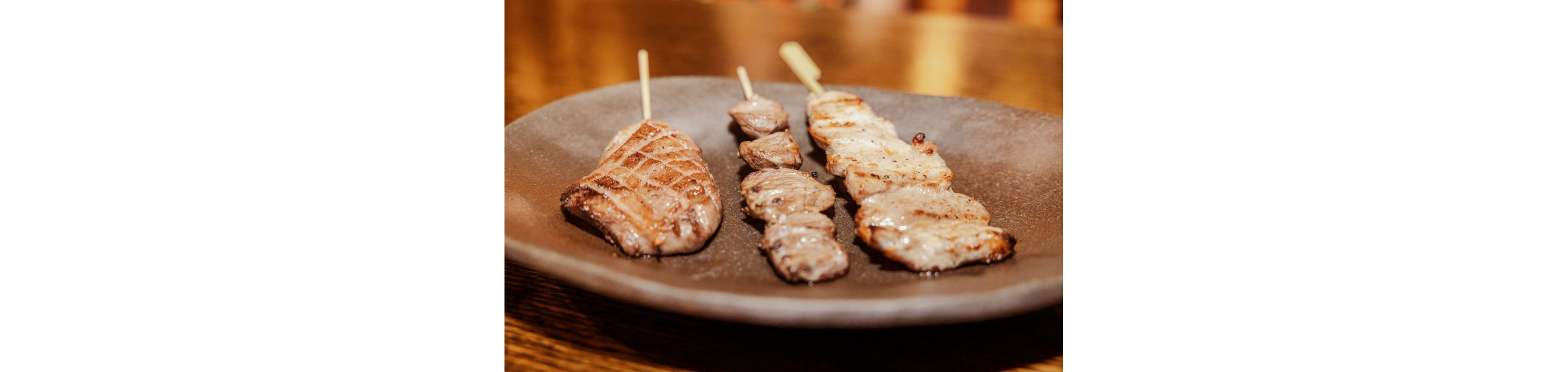 Skewers of cooked meat.