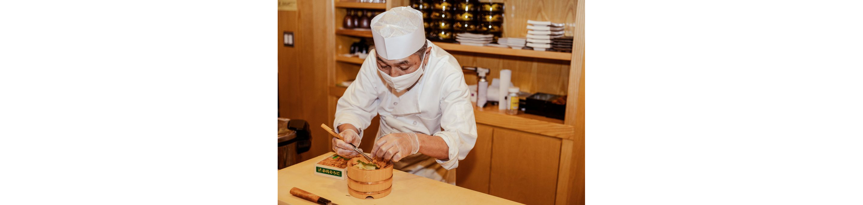 A chef delicately plating an ornate dish.