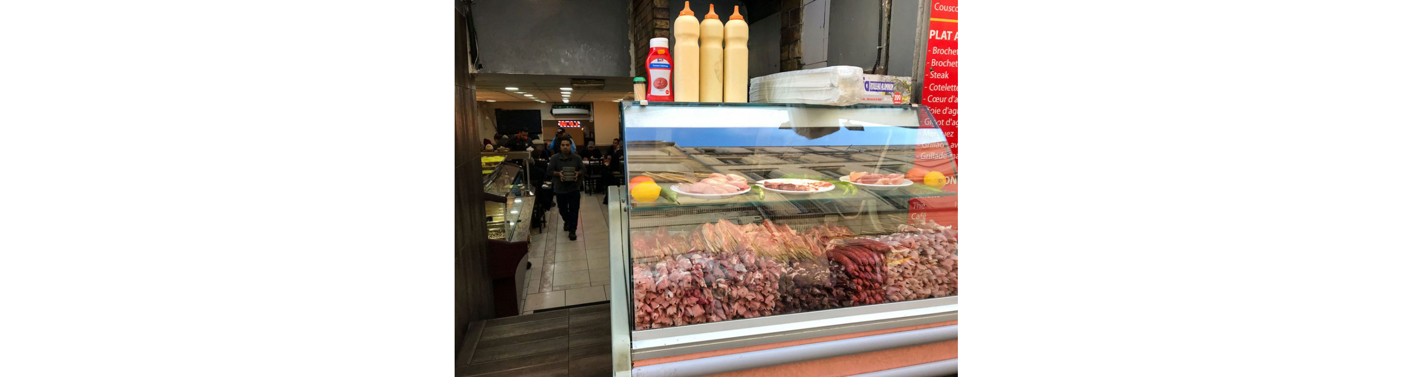 Meats sold at a storefront.