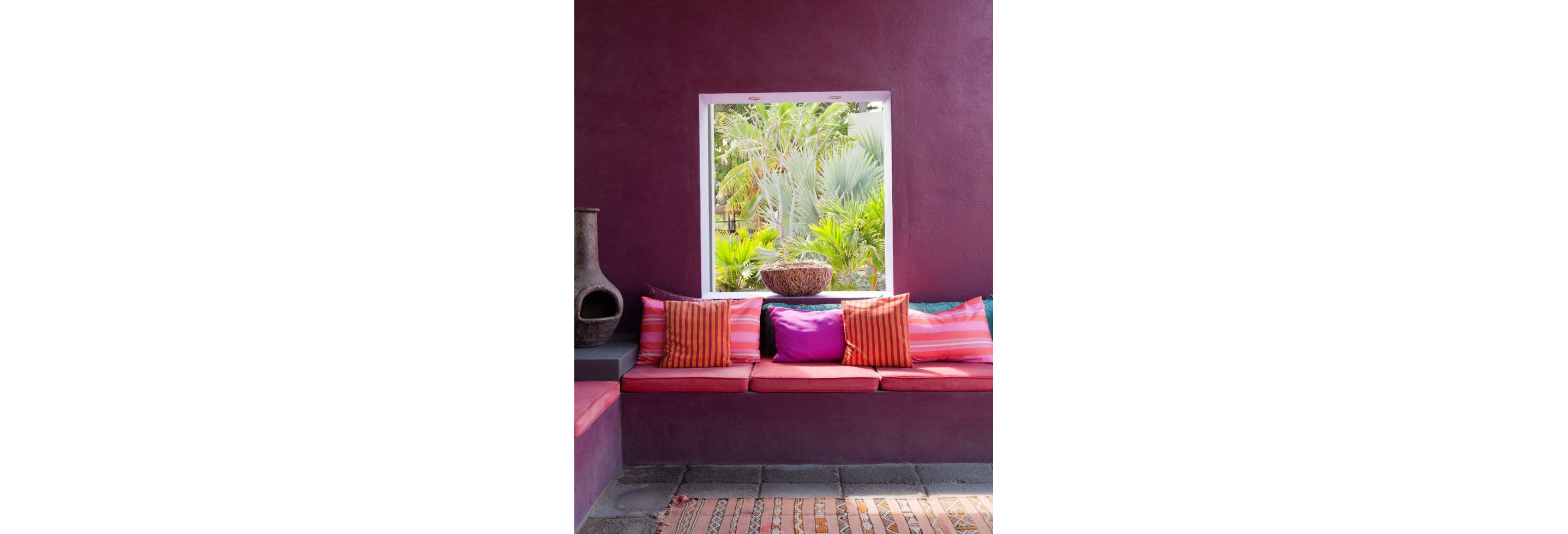 An outdoor living area in featuring beetroot tones.